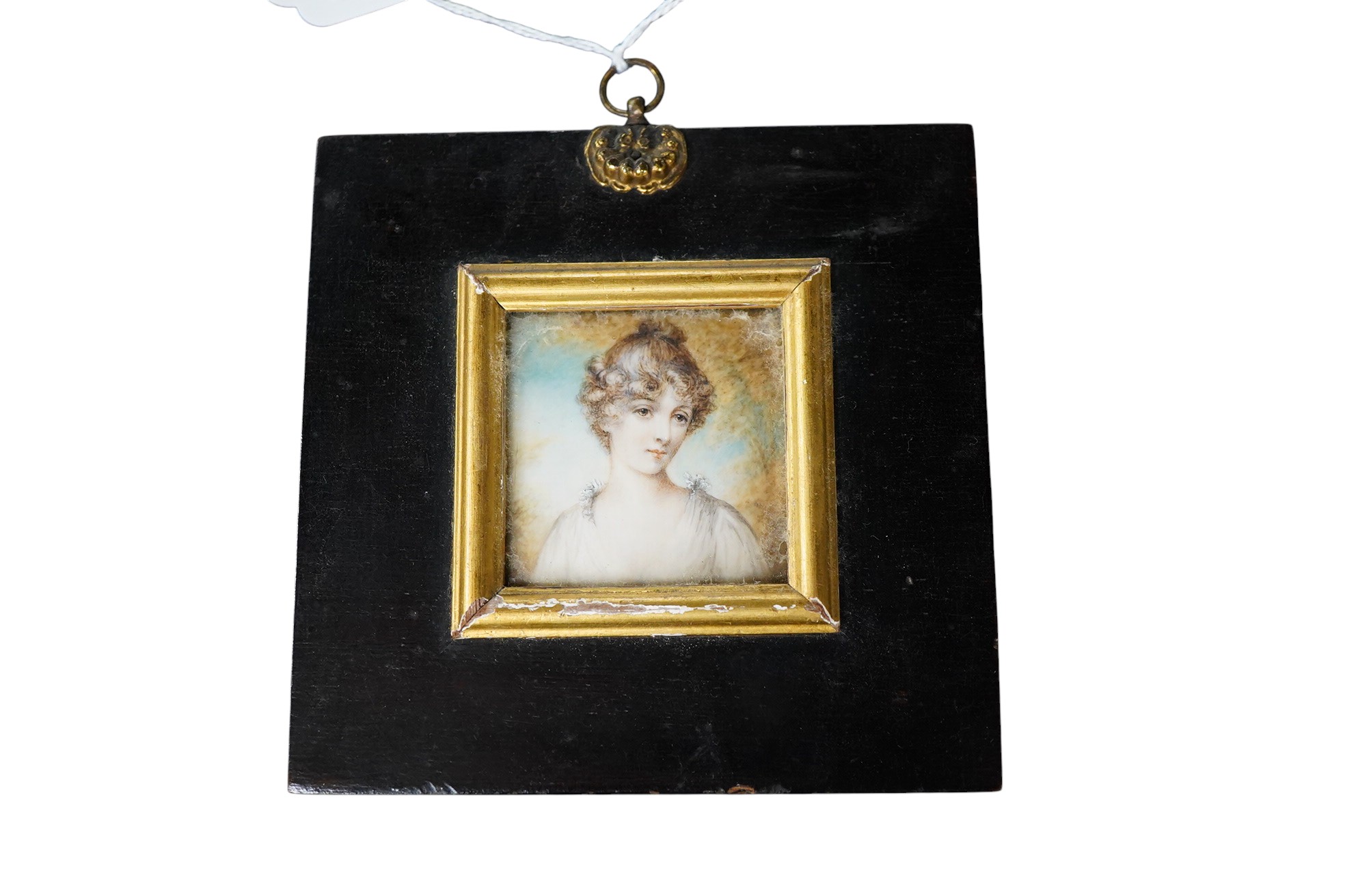 Regency School, Portrait miniature of a young lady before a landscape, watercolour on ivory, 5 x 5cm, housed in an ebonised and gilt frame CITES Submission reference ZWL53B45